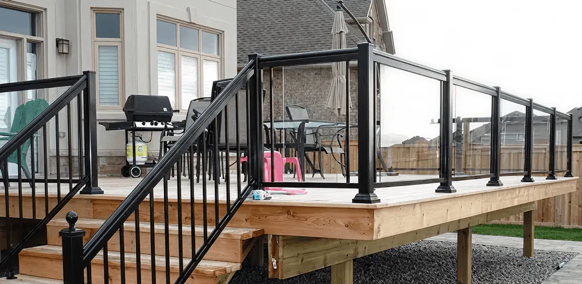 Handrail installation on a deck staircase for safety and code compliance in Green Bay, WI